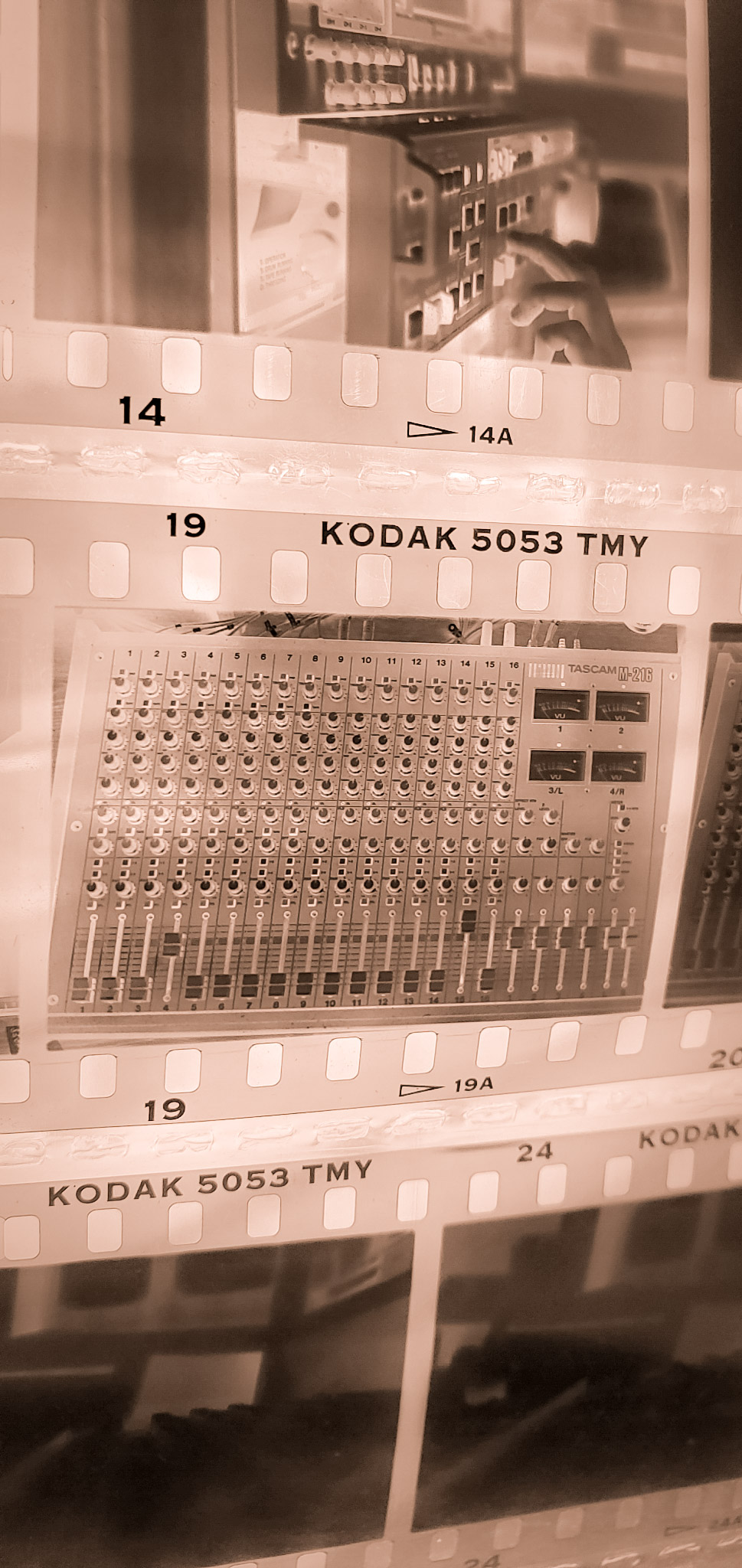 Contact sheet of 35mm film showing a TASCAM mixing console
